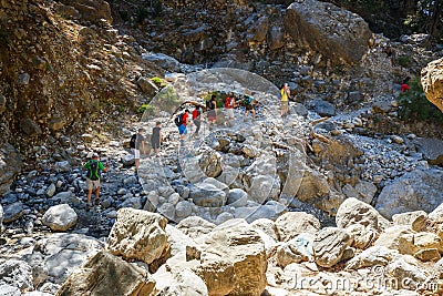 Tourists hike in Samaria Gorge in central Crete, Greece. The national park is a UNESCO Biosph Editorial Stock Photo