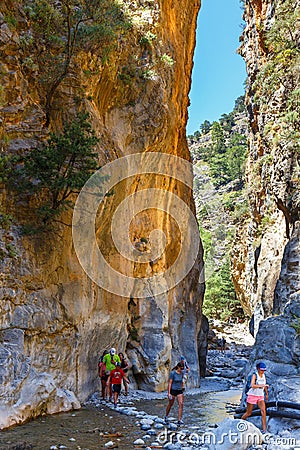 Tourists hike in Samaria Gorge in central Crete, Greece. The national park is a UNESCO Biosph Editorial Stock Photo