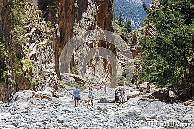 Tourists hike in Samaria Gorge in central Crete, Greece. The national park is a UNESCO Biosph Editorial Stock Photo