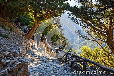 Tourists hike in Samaria Gorge in central Crete, Greece. The national park is a UNESCO Biosph Editorial Stock Photo