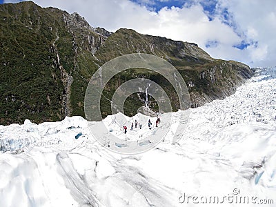 Tourists hiking on Fox Glacier, New Zealand Stock Photo