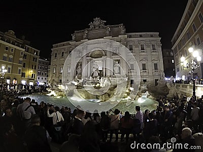 Tourists at Illuminated Fontana Di Trevi, Trevi Fountain at night, Rome, Italy April, 2019 Editorial Stock Photo