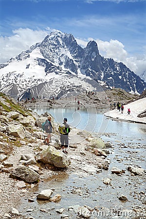 Tourists at Lac Blanc in Mont Blanc massif Editorial Stock Photo