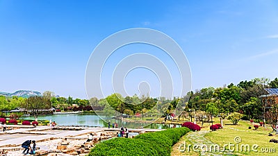 Tourists on leisure vacation in Silvery Waterfall and Fish Viewing Scenic Area Editorial Stock Photo