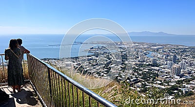 Tourists look at aerial view of Townsville from Castle Hill Queensland Australia Editorial Stock Photo