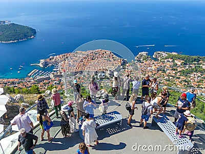 Tourists looking out over panorama view of old town of Dubrovnik Editorial Stock Photo