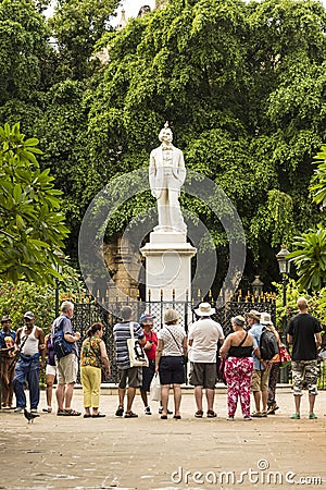 Tourists looking at statue of Cespedes Havana Editorial Stock Photo