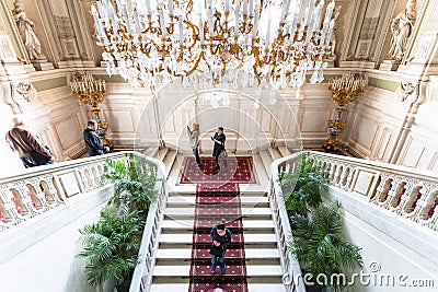 Tourists on main staircase in Yusupov palace Editorial Stock Photo
