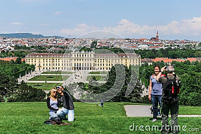 Tourists make photo on the background Schonbrunn Palace, Vienna Editorial Stock Photo