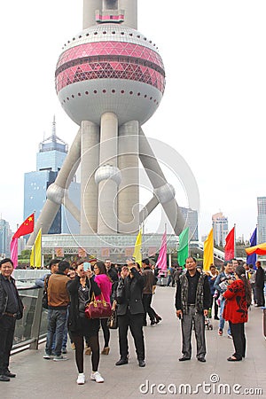 Tourists make selfies at the Pearl Tower in Shanghai, China Editorial Stock Photo