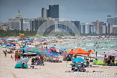 Tourists on Miami Beach. Getting ready for a day at the beach Editorial Stock Photo