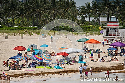 Tourists on Miami Beach. Getting ready for a day at the beach Editorial Stock Photo