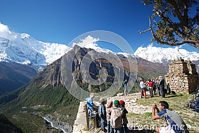 Tourists and Nepali kids in the nature Editorial Stock Photo