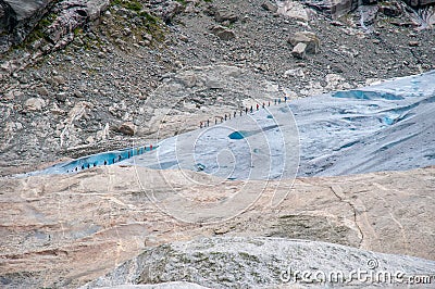 Tourists on Nigardsbreen glacier in Western Norway Stock Photo