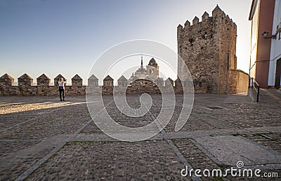 Tourists observing St. Maria Church from Templars Fortress, Jerez de los Caballeros, Spain Editorial Stock Photo