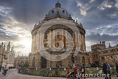 Tourists outside The Radcliffe Camera circular library building at Oxford Editorial Stock Photo