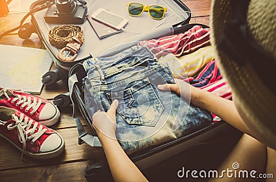 Tourists are packing luggage for travel. Stock Photo