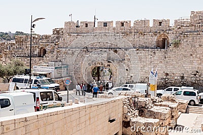 Tourists pass through the Dung Gates in the Old City of Jerusalem, Israel Editorial Stock Photo