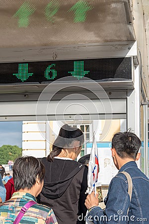 Tourists pass through the gate Editorial Stock Photo