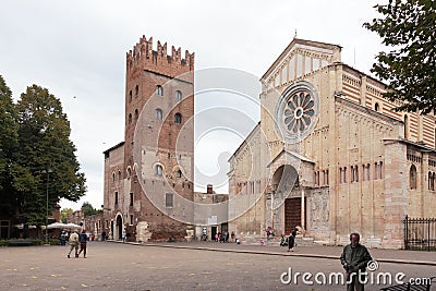 Tourists and passersby walk near Basilica di San Zeno Maggiore Editorial Stock Photo