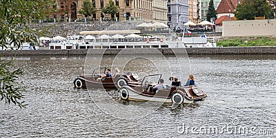 Tourists on pedal boats glide on the Vltava river in Prague Editorial Stock Photo