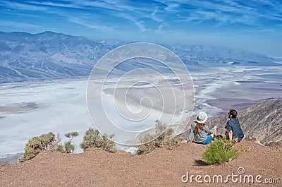 Tourists people enjoying view desert landscape of Badwater in Death Valley, USA. Stock Photo