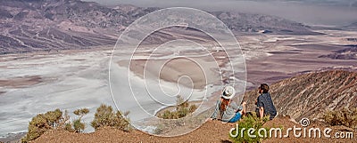 Tourists people enjoying view desert landscape of Badwater in Death Valley, USA. Stock Photo