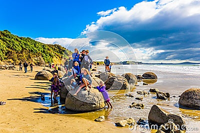 Tourists photograph the Boulders Moeraki Editorial Stock Photo