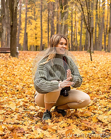 Tourists photograph young woman of 30 years old taking photos with a smile on her face, free time, vacation concept, working with Stock Photo