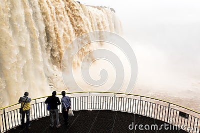 Tourists in a platform at iguazu falls veiw from brazil Editorial Stock Photo