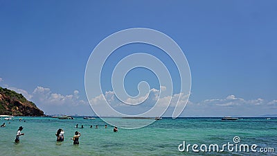 Tourists playing in the afternoon sea Editorial Stock Photo