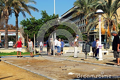 Tourists playing Petanque, Torre del Mar. Editorial Stock Photo