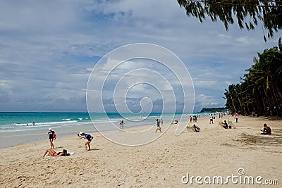 Tourists playing on wide sand coastline at Boracay Island, Philippines Editorial Stock Photo