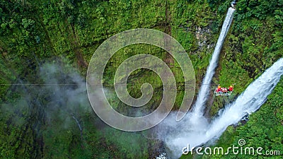 Tourists are playing zip line waterfall in Laos,Rainforest, Asia Editorial Stock Photo
