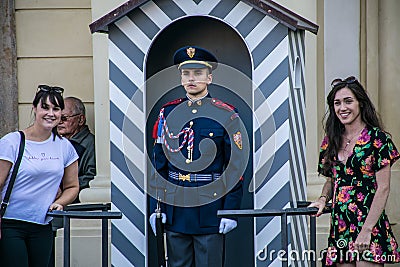 Prague, Czech Republic - September , 18, 2019: Tourists posing with the guards of honor guards at the presidential Editorial Stock Photo