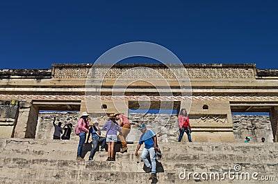Tourists are posing for photos in front of the main pyramid at t Editorial Stock Photo