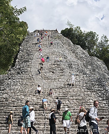 Tourists at the Pyramid Nohoch Mul of the Mayan Coba Ruins, Mexico Editorial Stock Photo