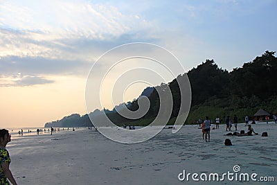 Tourists relaxing and enjoying the sunset at Radhanagar Beach, Havelock Island Editorial Stock Photo