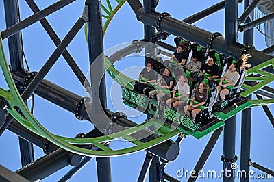 Tourists ride on Green Lantern in Movie World Gold Coast Queensland Australia Editorial Stock Photo