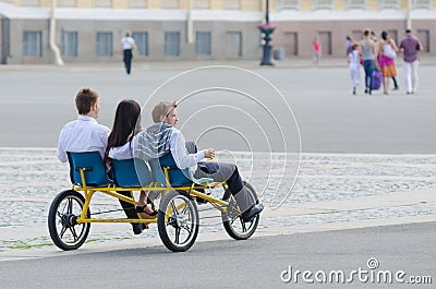Tourists ride tricycle in St. Petersburg Editorial Stock Photo