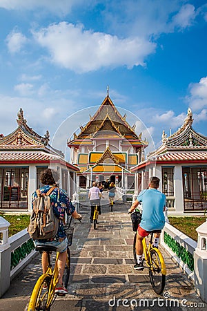 Tourists riding bicycles into Thailand temples Editorial Stock Photo