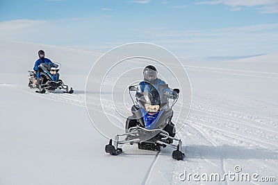 Tourists riding a snowmobile at Vatnajokull Glacier Editorial Stock Photo