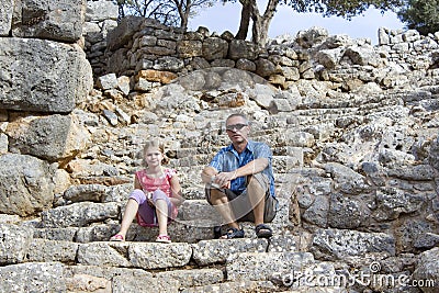 Tourists in the ruins of the ancient city of Lato Stock Photo