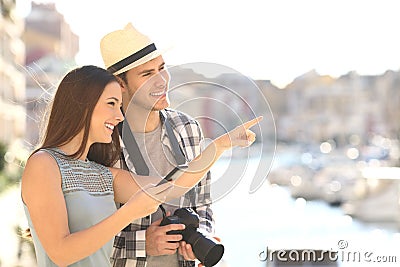 Tourists sightseeing in a coast town Stock Photo