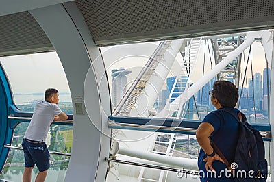 Tourists at Singapore ferris wheel Editorial Stock Photo