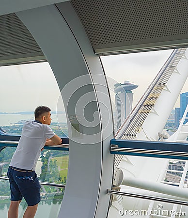 Tourists at Singapore ferris wheel Editorial Stock Photo