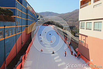 Tourists sliding downhill on snowboards Stock Photo