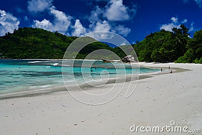 Tourists spending time on the beach - Baie Lazare beach, Mahe Island, Seychelles. Editorial Stock Photo