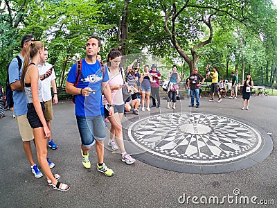Tourists at Strawberry Fields in Central Park in New York Editorial Stock Photo