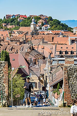 Tourists on the streets in the old town of Brasov. Editorial Stock Photo